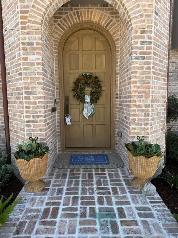 Front porch with pumpkins and planters in West University